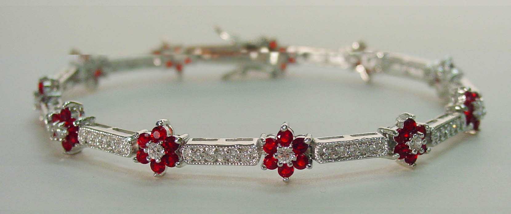 Ruby colored CZ small flower silver bracelet