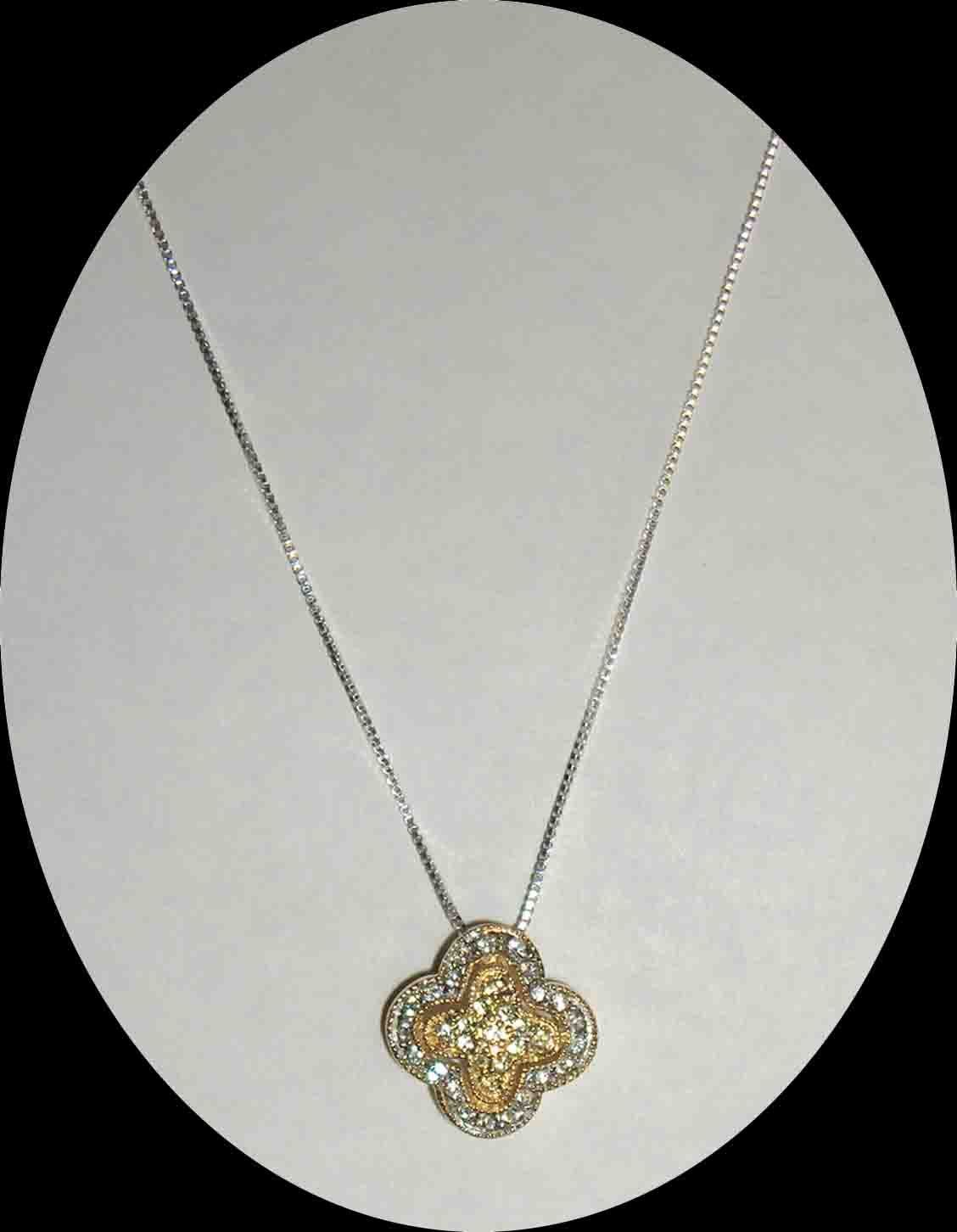CZ encrusted yellow gold & silver pendant necklace