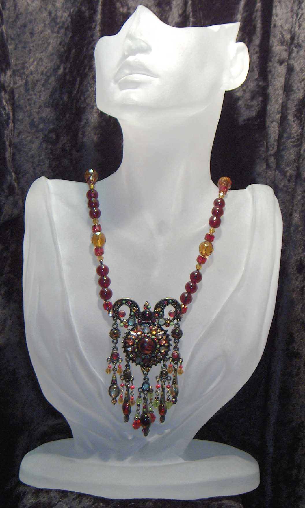 Red and yellow glass necklace with pendant