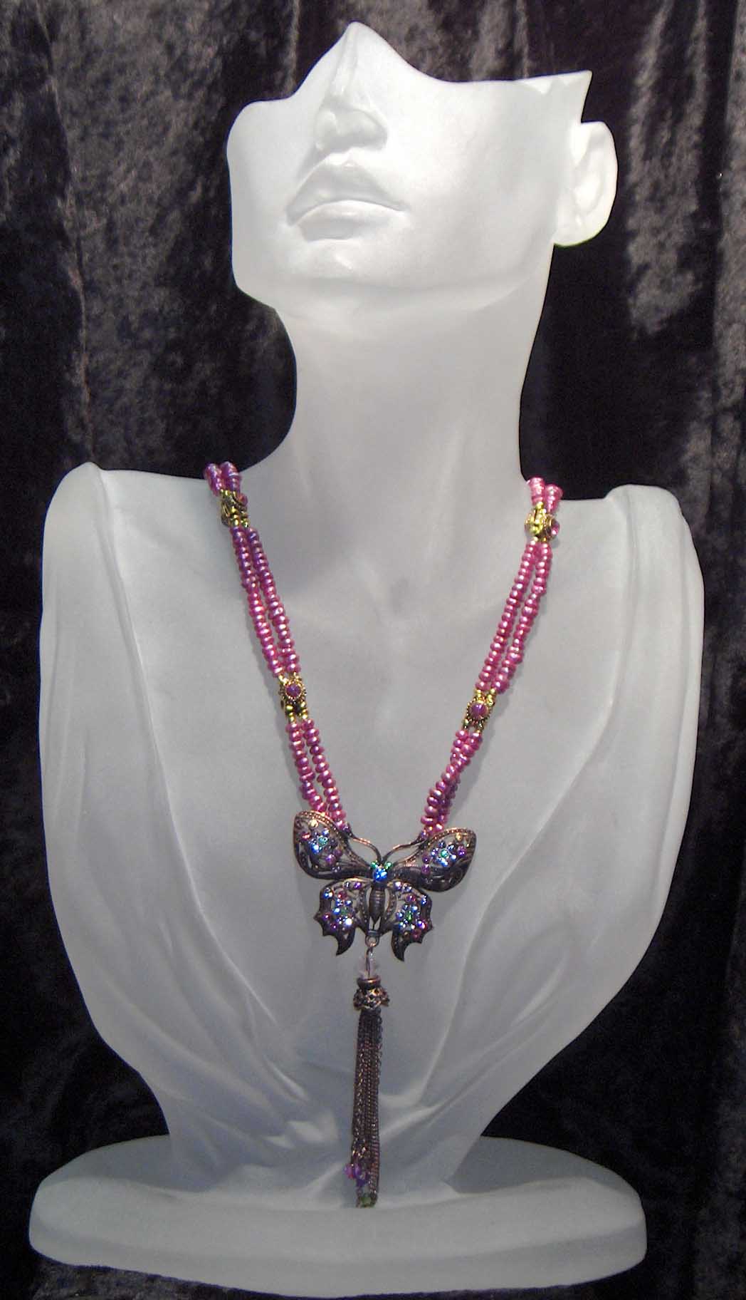 Dark pink fresh water pearls with crystal butterfly pendant